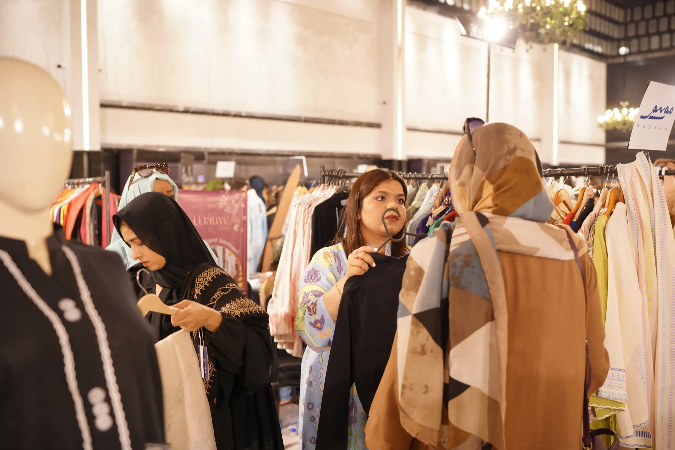 Shoppers looking at festive pret outfits