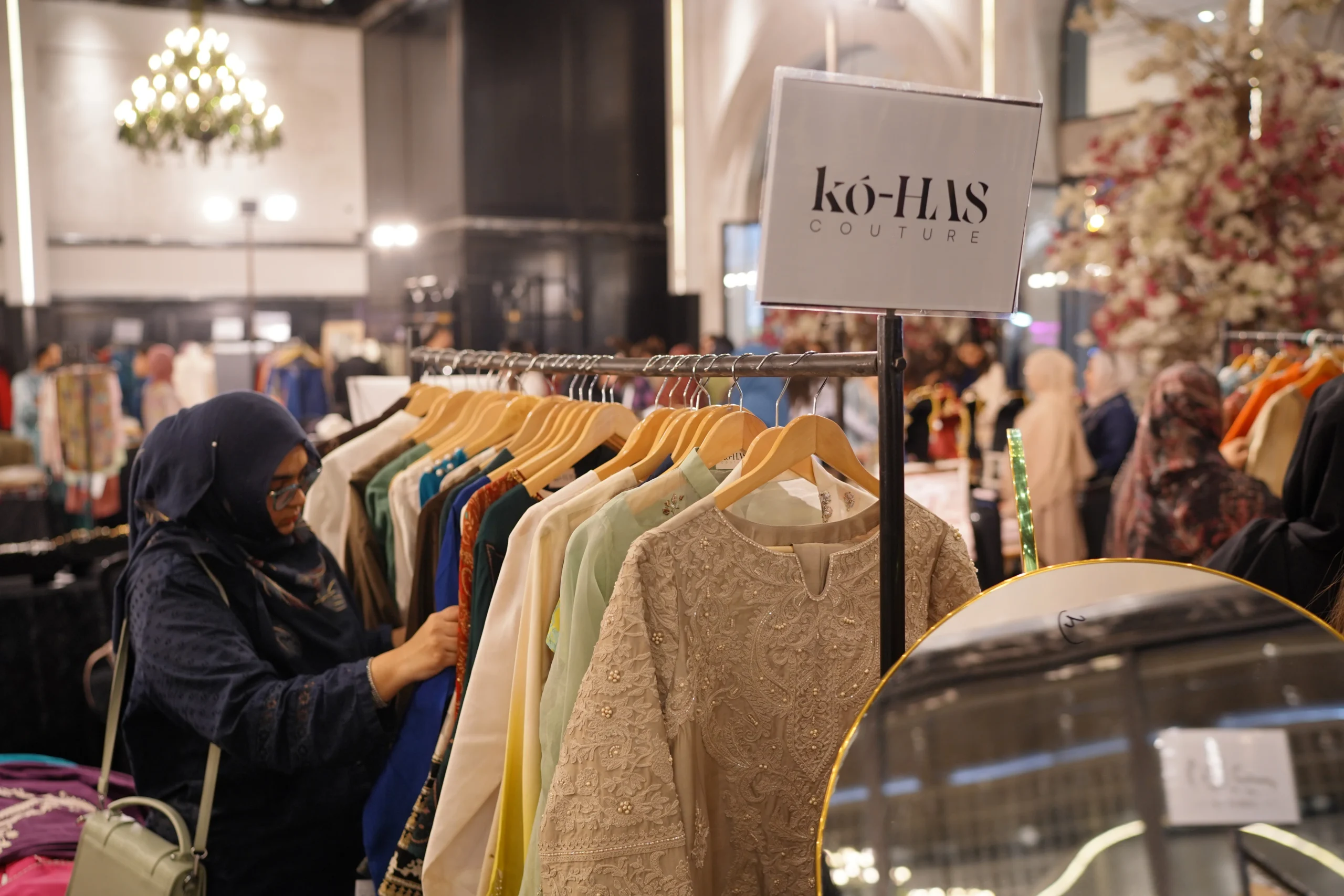 Browsing racks of designer clothing