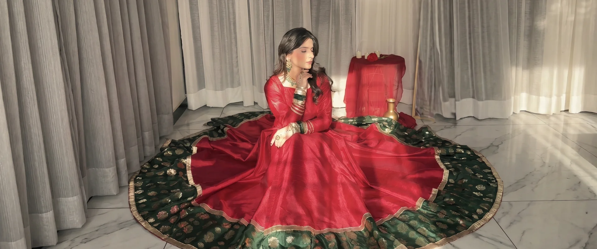 Model in a pistachio-green hand-embroidered Bushra Shakeel pret kameez with matching floral-printed dupatta, styled in a soft sunlit interior