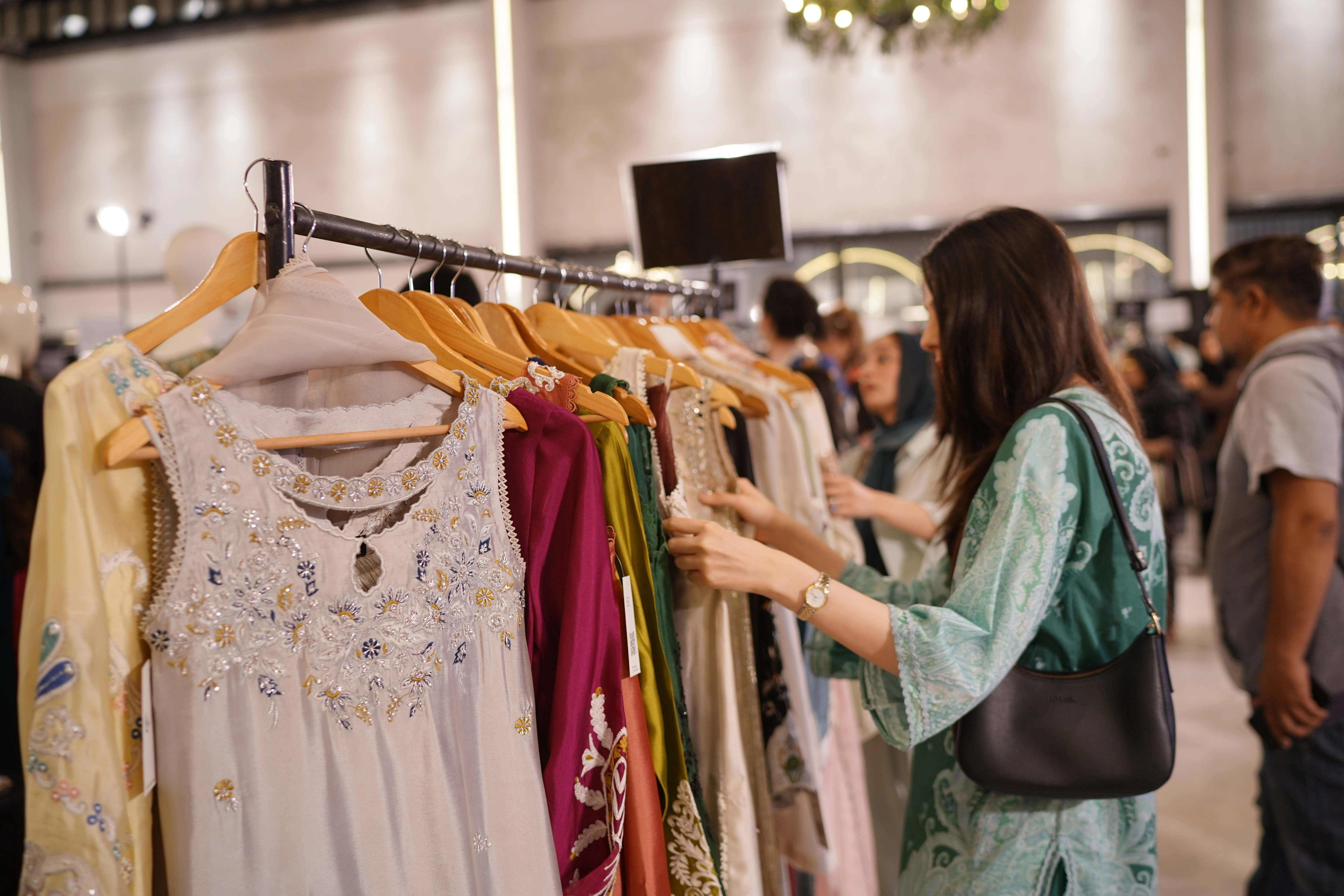 Shoppers browsing the rails at Ensemble Festive Souk